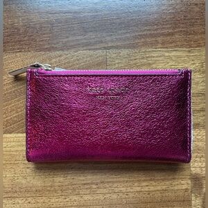 Kate Spade Morgan Small Slim Bifold Wallet in metallic pink